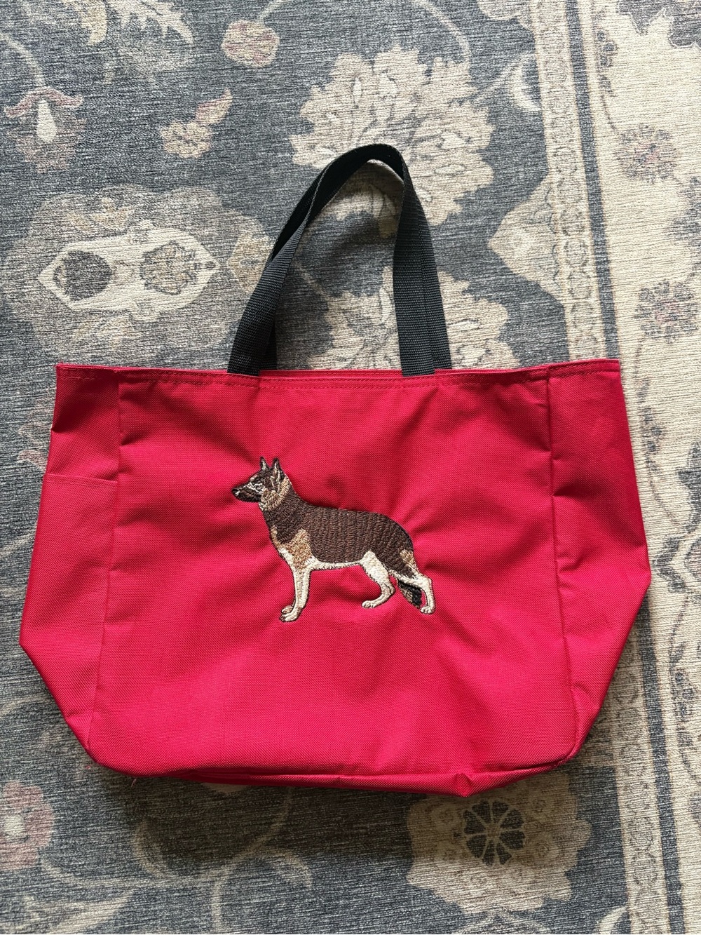 Red tote bag with German Shepard decal